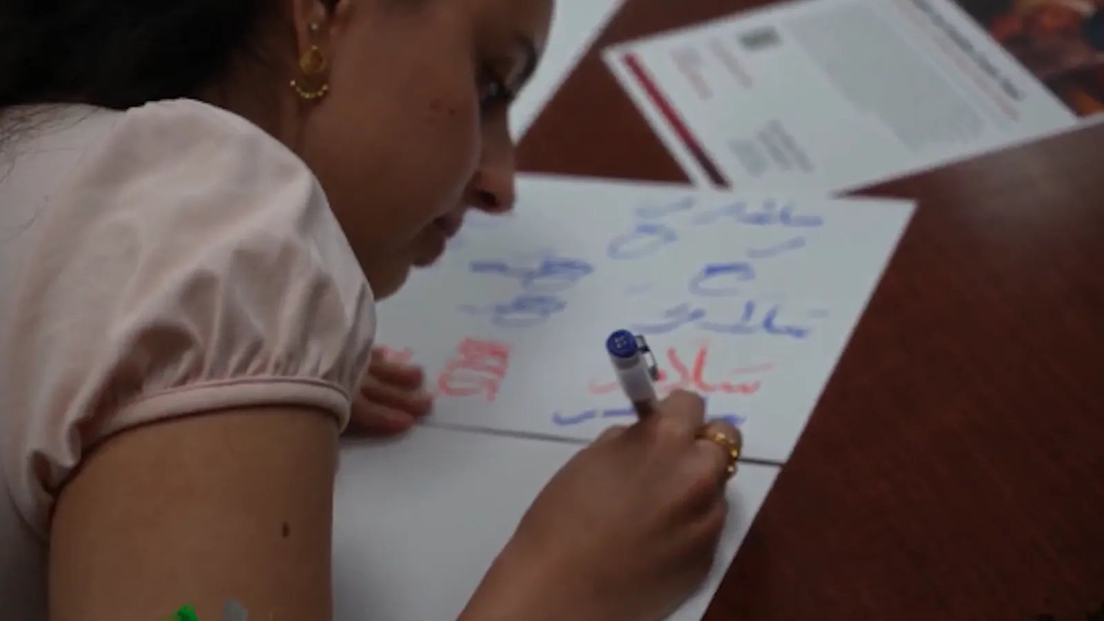 student writing calligraphy